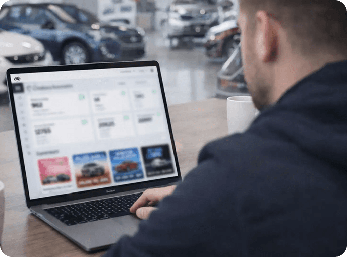 Salesperson responding to a new lead on a laptop
