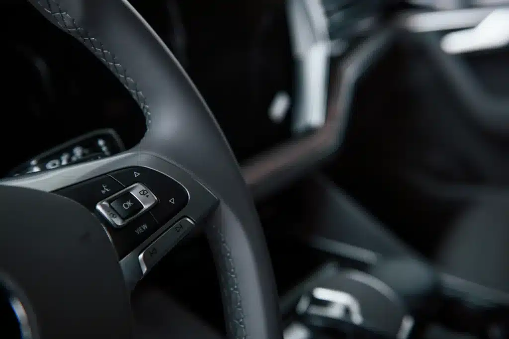 Close-up of car steering wheel buttons